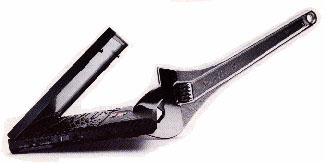 magazine ad showing a Thinkpad clamped in the jaws of a crescent wrench