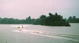 plane taking off from bayou