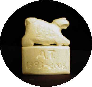 Monument in Ivory by Bob Cooper. It's a feline sculpture with 'A.T. 1993-2006' carved into the base