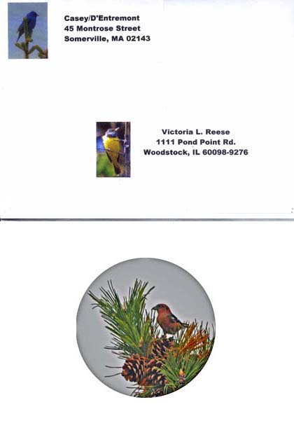 The front of the envelope with return address sticker decorated with an 
indigo bunting photo, and the address label decorated with a mourning warbler photo, and below the back of the envelope with a circularly cropped sticker of a photo of a male white-winged crossbill on a pinecone in a long-needled pine
.