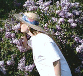Nancy sniffing lilacs